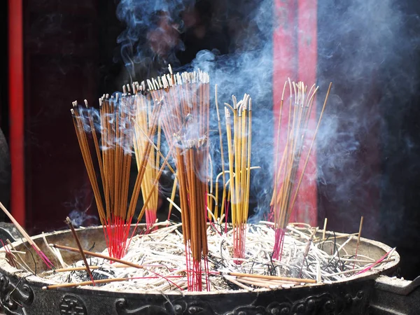 Smoke of incense sticks Stock Photo