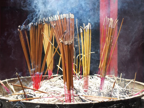 Smoke of incense sticks Stock Photo
