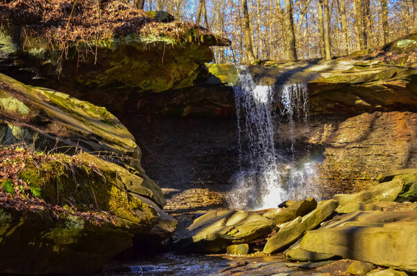 A small waterfall in the autumn in the forest in the parkon Brandywine Creek in Cuyahoga Valley National Park, Ohio. 