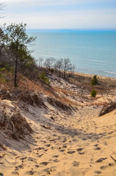 Sand dunes with traces of people on a sand path down. Indiana Dunes National Lakeshore, USA