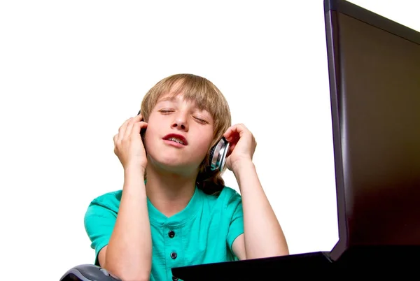 Boy using a laptop against a white background — Stock Photo, Image