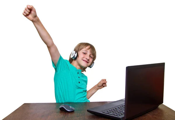 Boy using a laptop against a white background — Stock Photo, Image