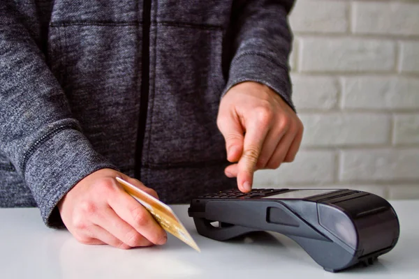 The process of payment for goods through the Terminal. Plastic card. Enter the password.