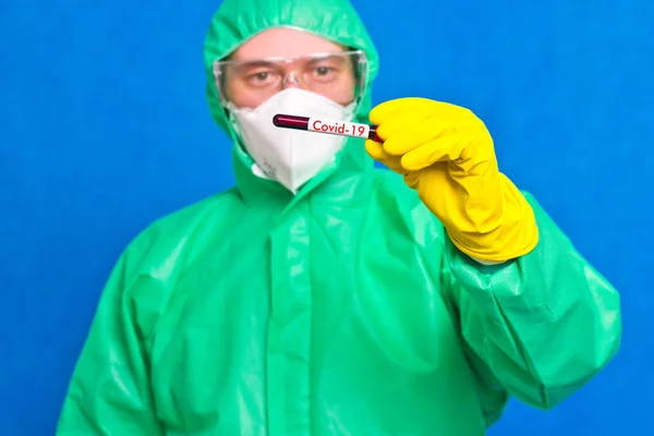 Medical Worker Coveralls Glasses Rubber Gloves Holds Test Tube Inscription — Stock Photo, Image