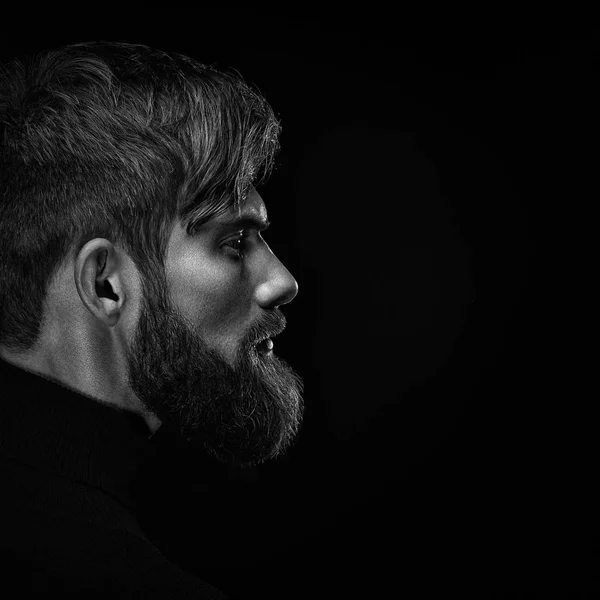 Black and white close up image of serious brutal bearded man on — Stock Photo, Image