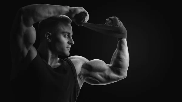 Black and white photo of man is wrapping hands with boxing wraps — Stock Photo, Image