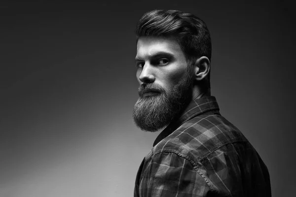 Black and white portrait of bearded handsome man in a pensive mood — Stock Photo, Image