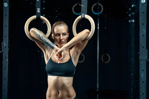 Woman training olympic ring in crossfit room — 스톡 사진