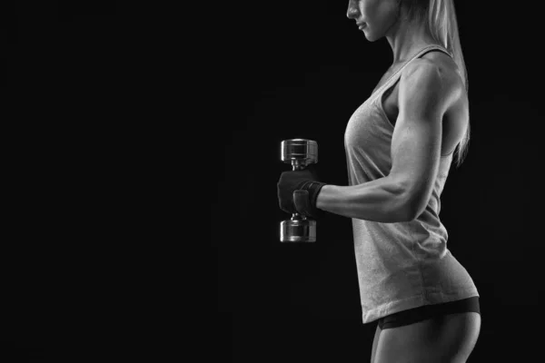 Female fitness model exercising with dumbbell — Stock Photo, Image