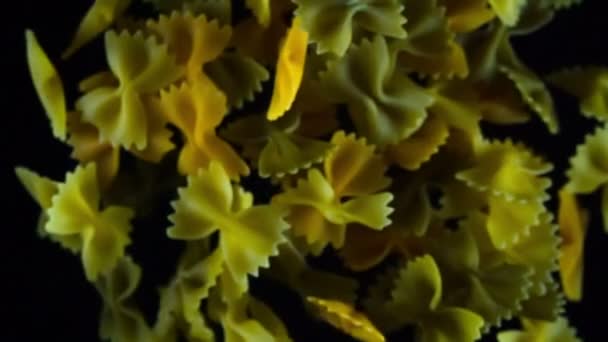Multi Colored Pasta Form Bows Falling Dark Background — Stock Video