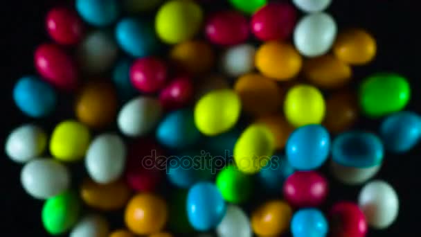 Explosion Colorful Candy Bright Candy Flying Out Darkness Hang Front — Stock Video