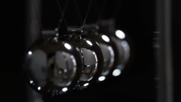 Slow Motion Newton Balls Loop Steel Shiny Balls Suspended Dark — ストック動画