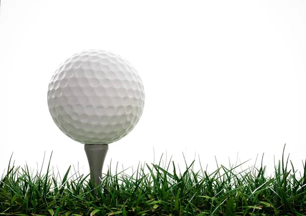 Golfball mit Abschlag im Gras Stockbild