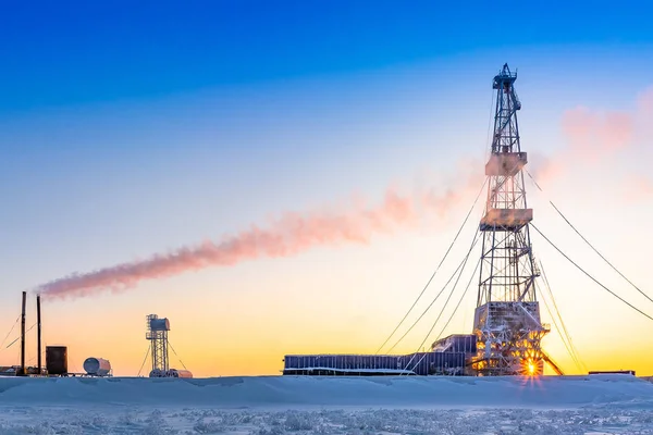 Winter polar day in the arctic. Drilling a well at a northern oil and gas field. Low sun. Beautiful lighting.