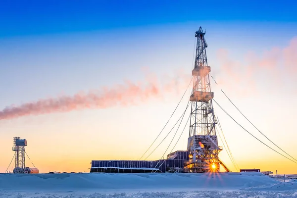 Winter polar day in the arctic. Drilling a well at a northern oil and gas field. Low sun. Beautiful lighting.