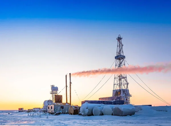 Winter polar day in the arctic. Drilling a well at a northern oil and gas field. Low sun. Beautiful lighting.