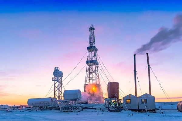 Winter polar day in the arctic. Drilling a well at a northern oil and gas field. Low sun. Beautiful lighting.