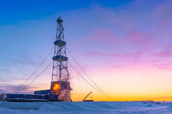 Winter polar day in the arctic. Drilling a well at a northern oil and gas field. Low sun. Beautiful lighting.