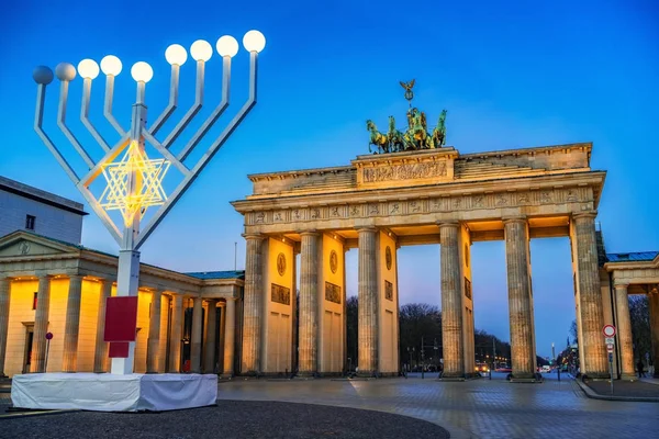 Brandenburg gate and hanukkah menorah — Stock Photo, Image