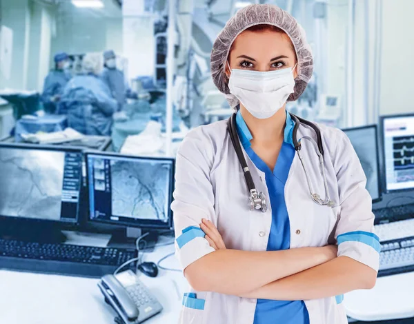 Female surgeon doctor at operation. Visualization on the monitor — Stock Photo, Image