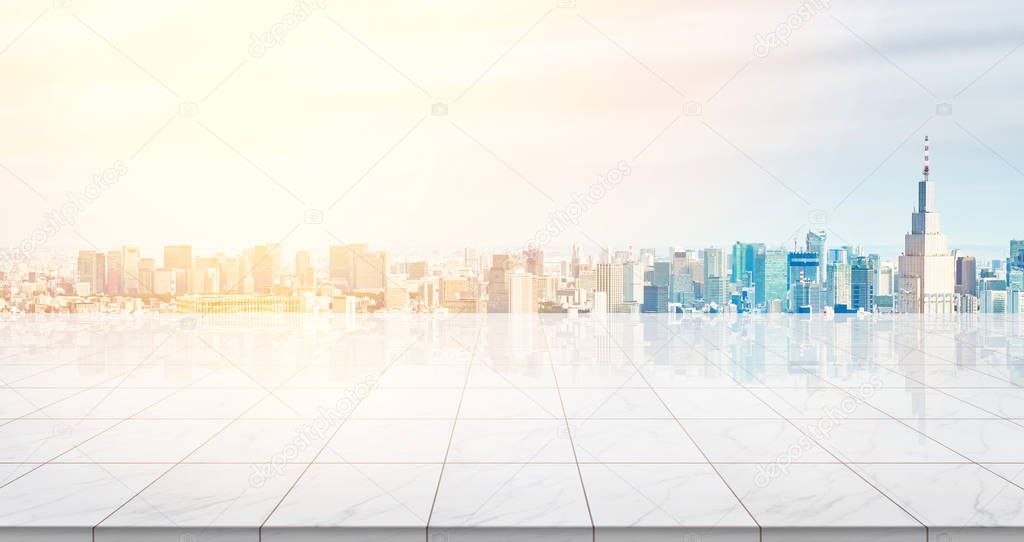 Business concept - Empty marble floor top with panoramic modern cityscape building bird eye aerial view under sunrise and morning blue bright sky of Tokyo, Japan for display or montage product