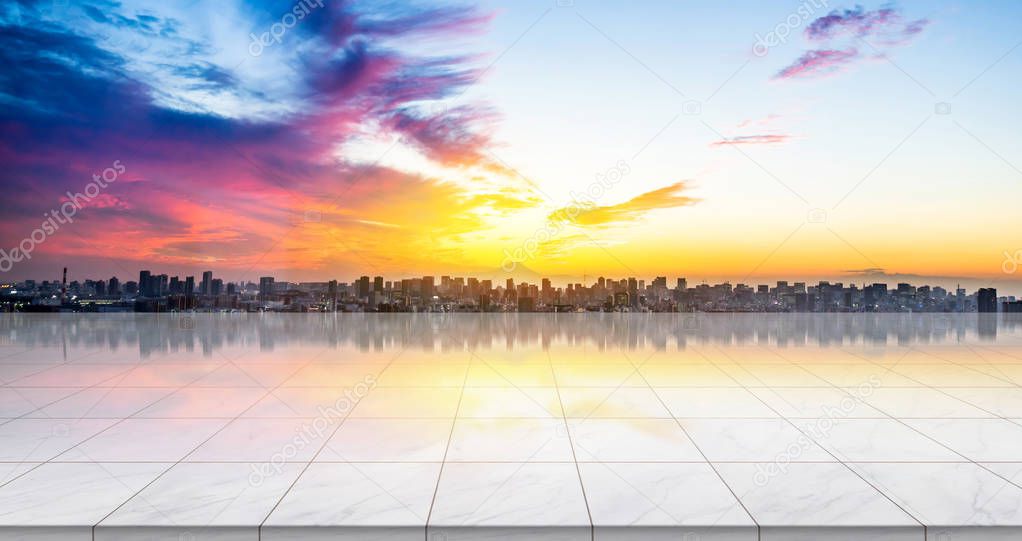 Business concept - Empty marble floor top with panoramic modern cityscape building bird eye aerial view under sunrise and morning blue bright sky of Tokyo, Japan for display or montage product