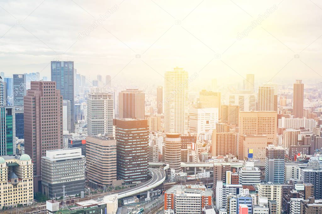 Business concept for real estate and corporate construction - panoramic modern city skyline bird eye aerial view with dramatic sunrise and morning sky in Osaka, Japan