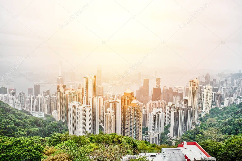 Business concept for real estate and corporate construction - panoramic modern city skyline bird eye aerial view with dramatic sunrise and morning blue sky in Hong Kong (HK), China