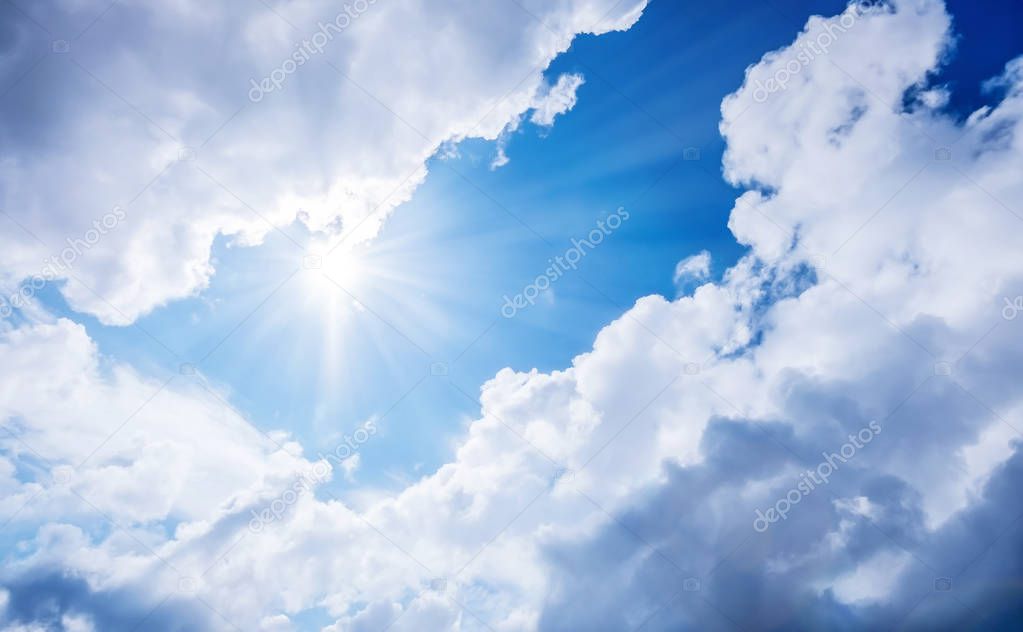 Fantasy blue sky with dramatic clouds under shining sun light