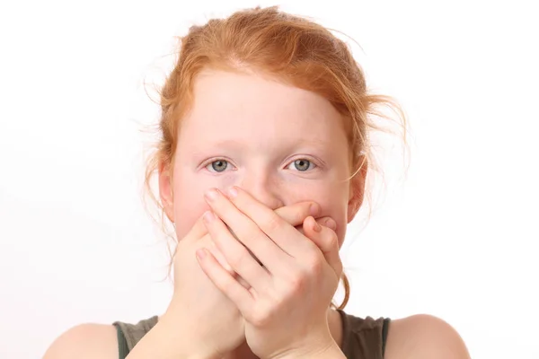 Girl covers mouth — Stock Photo, Image