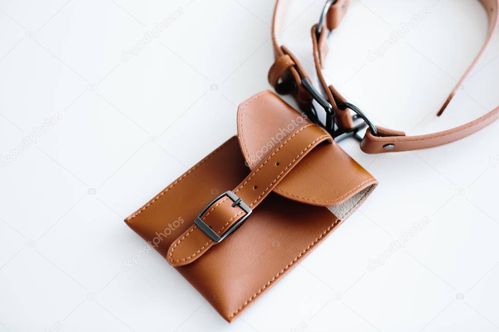 Brown waist bag with belt, isolated on white background