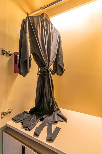 Black Bathrobe in wardrobe — Stock Photo, Image