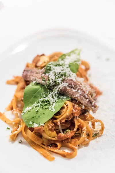 Spaghetti la puttanesca with anchovy — Stock Photo, Image