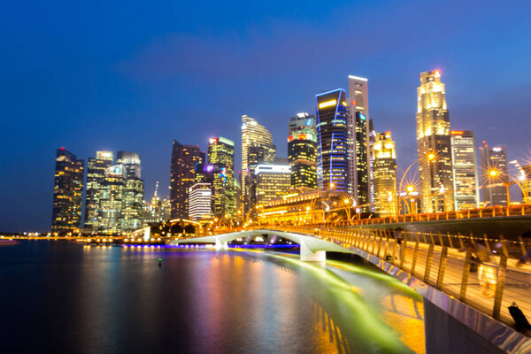 Singapore downtown cityscape with modern skyline and city skyscrapers in sunset at Marina Bay