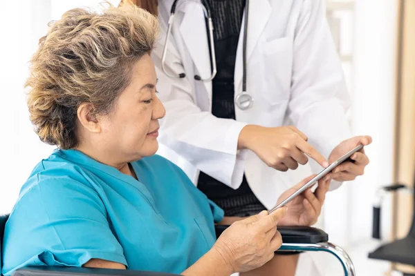 Asian Confidence Doctor Using Digital Tablet Expressing Health Concerns Old — Stock Photo, Image