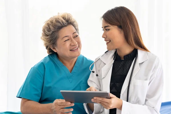 Asian Confidence Doctor Using Digital Tablet Expressing Health Concerns Old — Stock Photo, Image