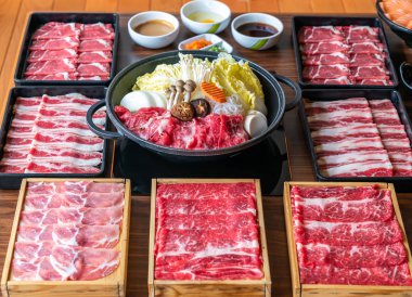 Japanese wagyu beef and kurobuta pork Sukiyaki set ready to cook clipart