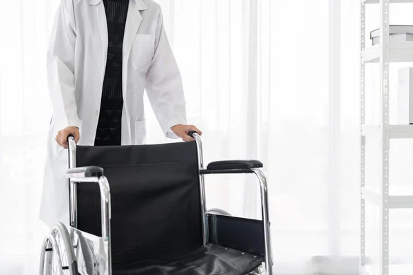 Closup Confident Female Doctor Medical Professional Holding Wheelchair Examination Room — Stock Photo, Image