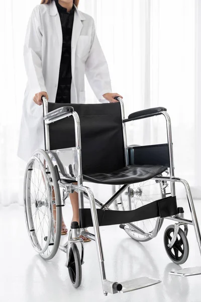 Closup Confident Female Doctor Medical Professional Holding Wheelchair Examination Room — Stock Photo, Image