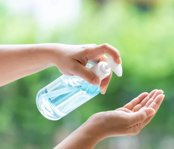 Close-up cleaning hand using alcohol gel hand sanitizer water-less in pump bottle, disinfection for safety prevent and protect from infection of virus and germ Covid-19 corona-virus world pandemic.