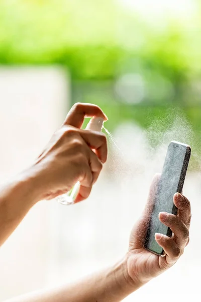 Close Cleaning Mobile Phone Using Alocohol Spray Bottle Spraying Disinfection — Stock Photo, Image