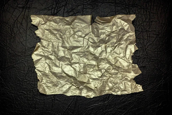 Crumpled Paper Gold Color Uneven Ragged Edges Black Textural Background — Stock Photo, Image