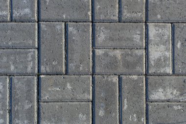 Döşeme taşlarının gri dokusu. Kaldırımlar için taş fayanslara yakın çekim