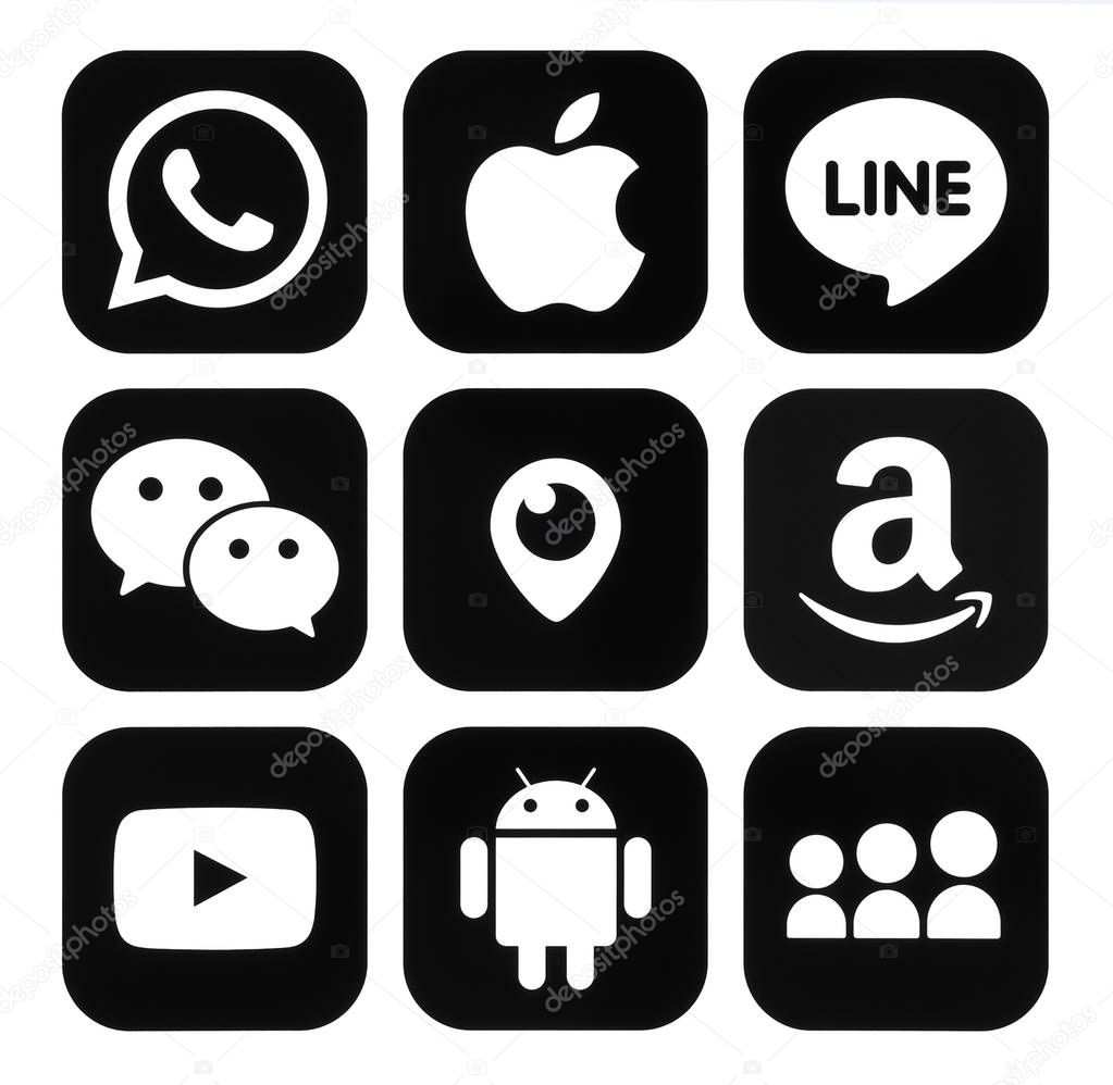 Kiev, Ukraine - November 7, 2016: Collection of popular mobile apps black logos printed on paper: Viber, Apple, Line, WeChat, Periscope, Amazon, Youtube, Android and MySpace
