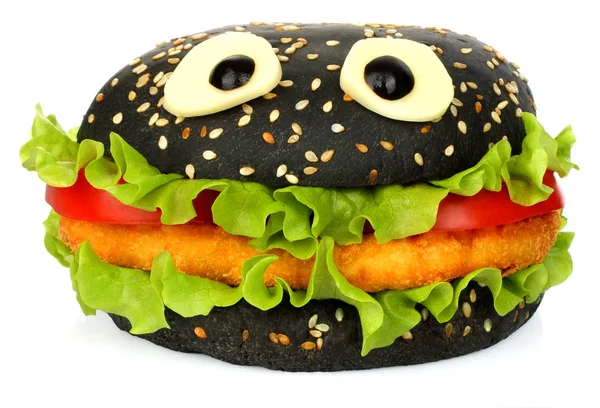 Großer schwarzer lustiger Hamburger mit Käseaugen — Stockfoto