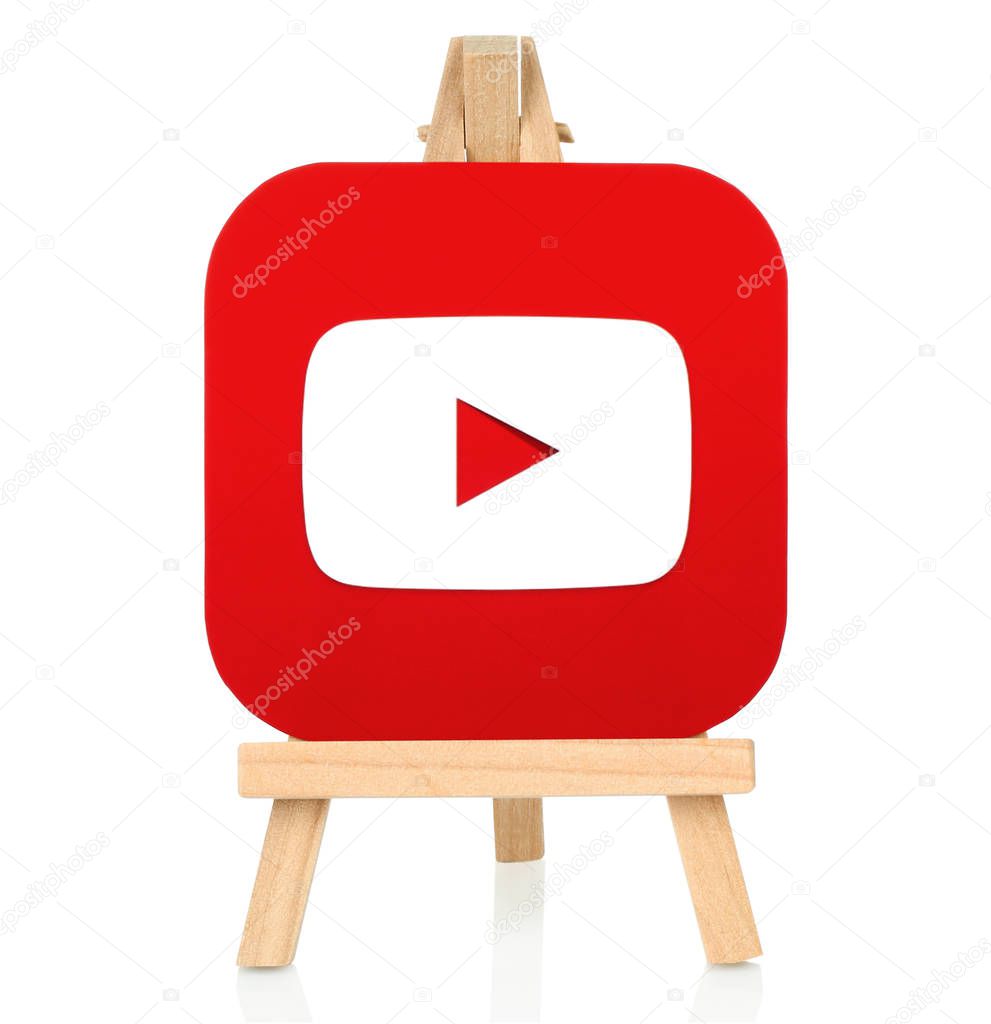 Kiev, Ukraine - August 30, 2016: Youtube icon printed on paper and placed on wooden easel. YouTube is a video-sharing website