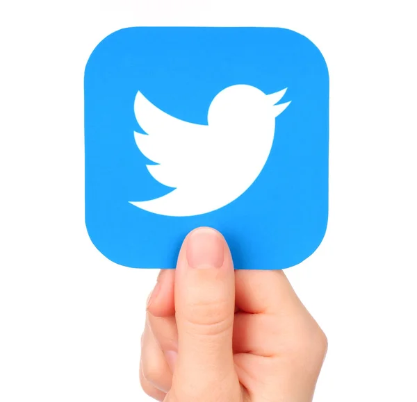Hand holds Twitter icon printed on paper — Stock Photo, Image