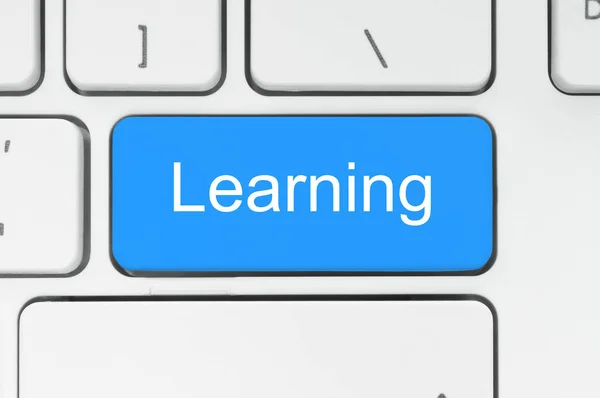 学习单词在键盘上的蓝色按钮 — 图库照片