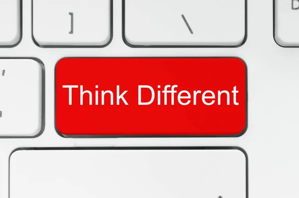 Red button with think different words on the keyboard — Stock Photo, Image