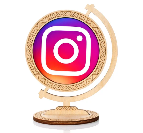 Instagram circle icon placed into wooden globe — Stock Photo, Image